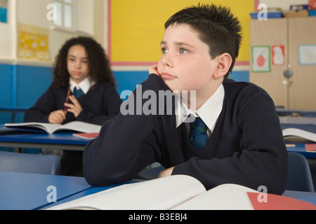 Bored students in classroom Banque D'Images