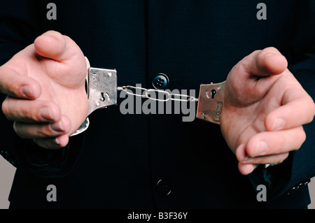 Businessman in Handcuffs Close Up Banque D'Images