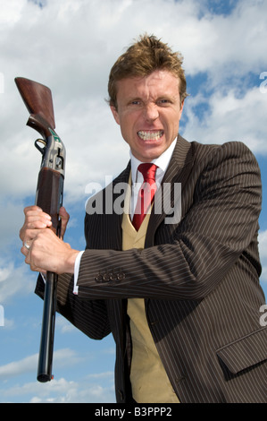 Business Man with gun club de golf parapluie drapeaux Shoot pas 3642 Parution du modèle Banque D'Images