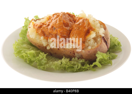 Veste fraîchement cuits au four pomme de terre rempli de Style indien Curry de poulet tikka masala et aucun peuple Banque D'Images