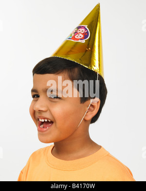 Asian boy with paper hat Banque D'Images