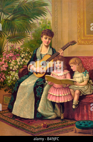 Impression de l'ère victorienne montrant mère avec guitare et deux enfants chantant des chants de Noël Banque D'Images