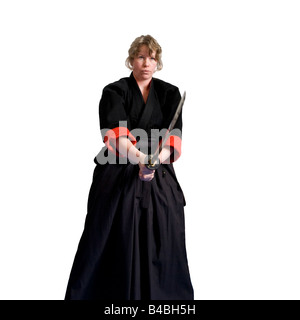 Art martial féminin fighter - performance dans une tenue traditionnelle Banque D'Images