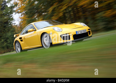 Porsche 911 GT2, l'année de modèle 2007-, jaune, conduite, déménagement, la diagonale de l'avant, vue frontale, country road Banque D'Images