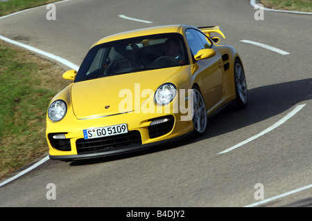 Porsche 911 GT2, l'année de modèle 2007-, jaune, conduite, déménagement, la diagonale de l'avant, vue frontale, country road Banque D'Images