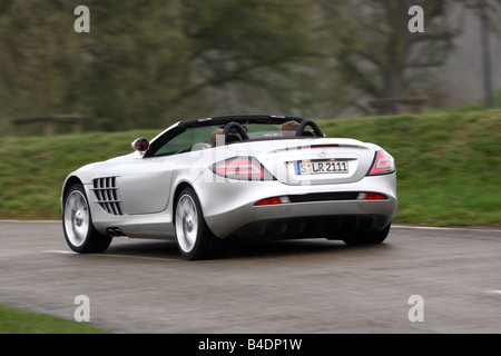 Mercedes SLR McLaren, l'année de modèle 2008, d'argent, la conduite, la diagonale de l'arrière, vue arrière, country road, open top Banque D'Images