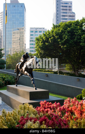 Statue en bronze de jockey sur piédestal, Hong Kong, Chine Banque D'Images