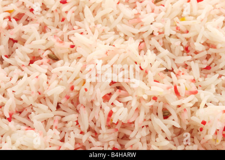 Des plats à emporter indien savoureux Riz Pilau coloré Ordre côté isolés contre un fond blanc avec un chemin de détourage et aucun peuple Banque D'Images