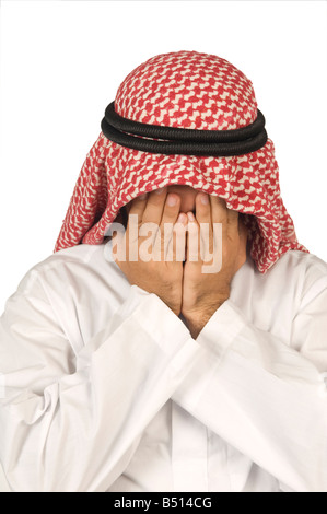 L'homme arabe head in hands Banque D'Images