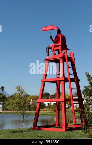 Protection de la vie en rouge avec un parasol rouge (parapluie) Banque D'Images