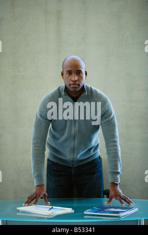 African businessman looking serious in office Banque D'Images