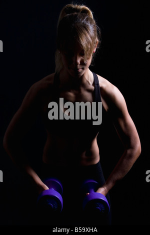 Portrait of young woman at fitness studio Banque D'Images