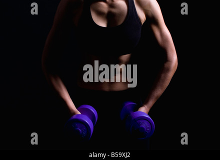 Portrait of young woman at fitness studio Banque D'Images