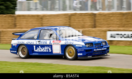 1990 Ford Sierra RS500 concurrent BTCC avec chauffeur Greg Rose à Goodwood Festival of Speed, Sussex, UK. Banque D'Images