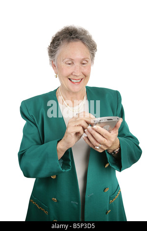 Un joli senior business woman checking her pda isolated on white Banque D'Images