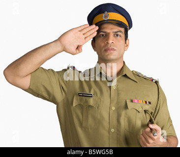 Portrait of a policeman saluting Banque D'Images