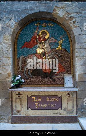 Saint George et le Dragon la peinture dans la cour de l'Église copte orthodoxe St George dans le quartier copte Le Caire Egypte Banque D'Images