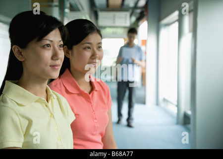 Close-up of two female office workers looking away Banque D'Images