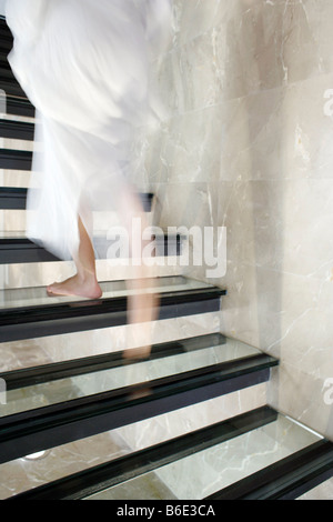 Woman ascending stairs, low section Banque D'Images