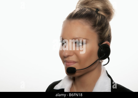Businesswoman wearing headset Banque D'Images