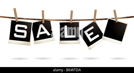 Instant photos accroché à un lave-ligne avec texte vente Banque D'Images