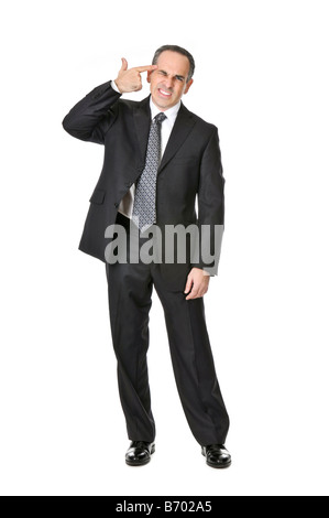 Businessman in a suit gesturing suicide isolé sur fond blanc Banque D'Images