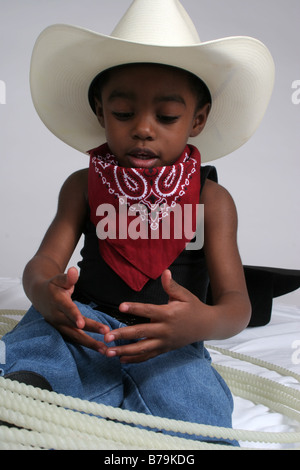 African American boy playing cowboy Banque D'Images