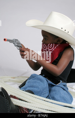 African American boy playing cowboy Banque D'Images