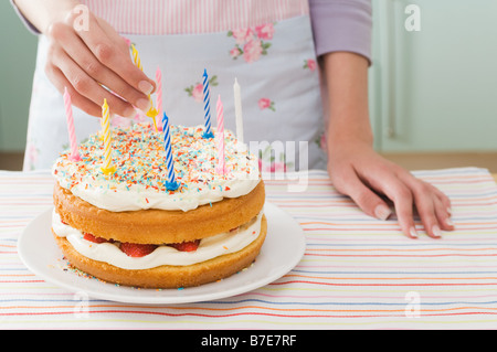 Woman with birthday cake Banque D'Images