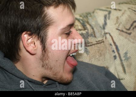 Sticking Out Tongue Banque D'Images