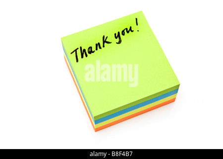 Merci de message sur un post it isolated on a white background studio Banque D'Images