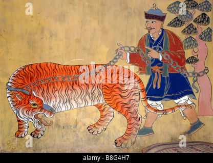 Peinture murale d'une mongole avec un tigre enchaîné Banque D'Images