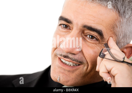 Aux cheveux gris à maturité à la pensée créative homme isolé sur fond blanc Banque D'Images