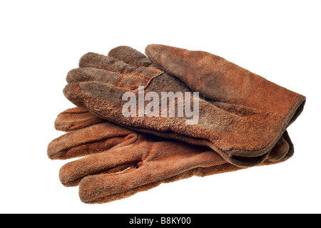 Vieux grungy gants de travail isolé sur fond blanc Banque D'Images