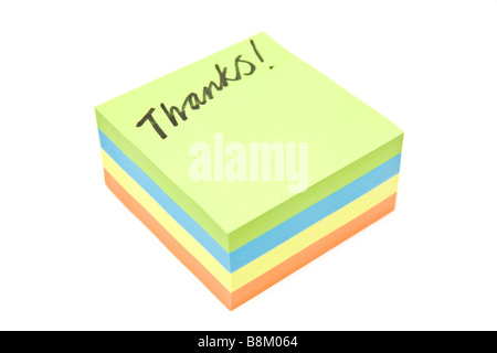 Merci écrit sur un post it isolated on a white background studio Banque D'Images