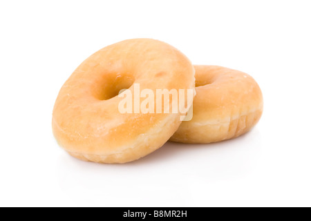 Deux donuts ou beignets empilé isolated on white Banque D'Images