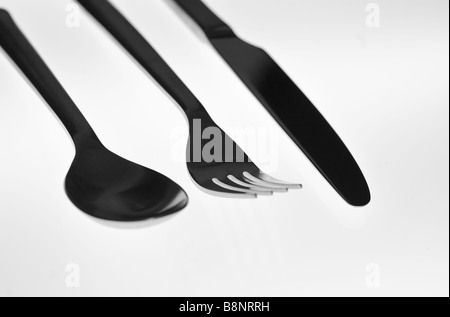 La silhouette d'une image vivante du coin ustensiles (cuillère, fourchette, couteau) et avec un fond blanc Banque D'Images