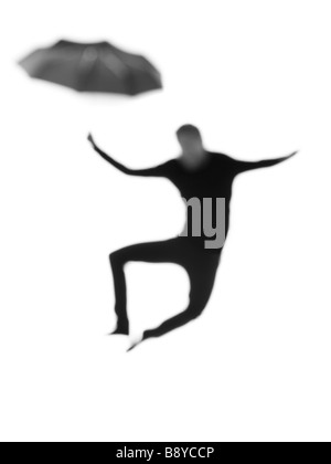 Silhouette d'un homme avec un parapluie. Banque D'Images
