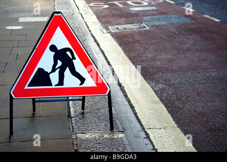 L'homme au travail Sign Banque D'Images