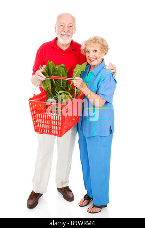 Beau couple pour l'achat des aliments biologiques sains de corps complet Banque D'Images