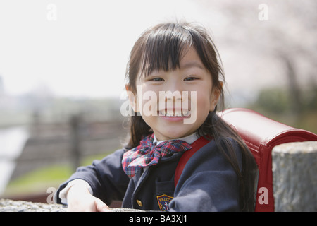 Japanese Schoolgirl smiling and looking at camera Banque D'Images