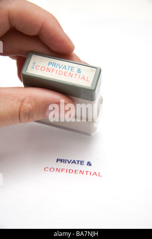 Confidentiel privé stamp on a white background studio. Banque D'Images