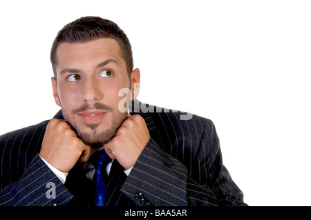 Businessman putting son menton dans les mains Banque D'Images