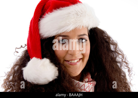 Fermer voir of young woman wearing christmas hat Banque D'Images