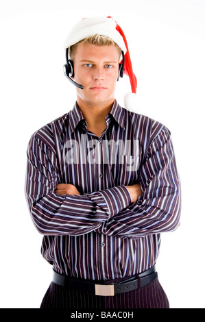 Portrait of young man wearing santa hat Banque D'Images