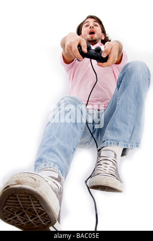 Jeune homme jouant des jeux vidéo Banque D'Images