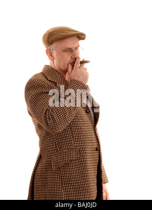 Avril 2009 - Anglais pays gent dans un Harris tweed veste fumant un grand cigare Banque D'Images