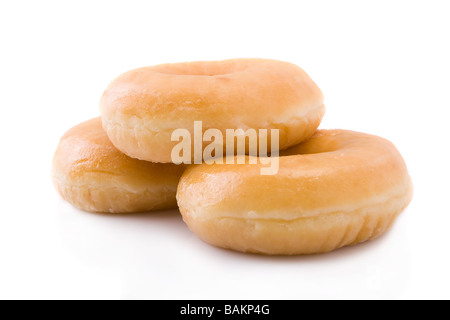 Trois donuts ou beignets empilé isolated on white Banque D'Images