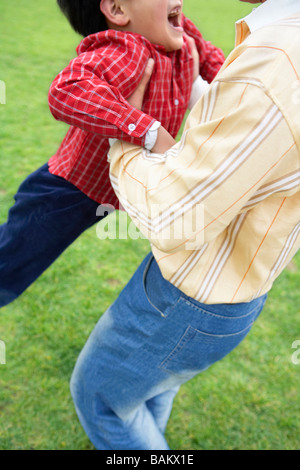 Father Carrying Son Banque D'Images