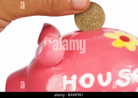 British pound in piggy bank Banque D'Images